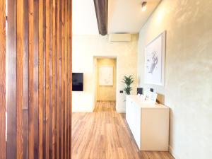 an office with a wooden wall and a desk at Pantheon Urbes Collection in Rome +87 photos