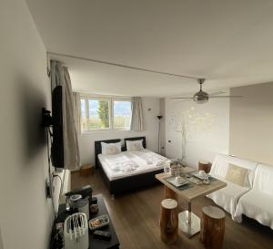 a living room with a couch and a table at B&B Mele d'Oro in Bolzano