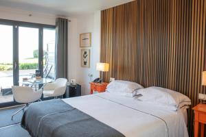 Postel nebo postele na pokoji v ubytování Hotel Arbe