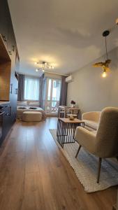a living room with a couch and a table at Studio79 in Plovdiv