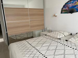 Ένα ή περισσότερα κρεβάτια σε δωμάτιο στο Grand appartement spacieux