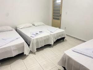 Voodi või voodid majutusasutuse Pousada Sagrada Devoção toas