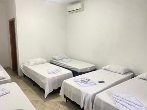 Voodi või voodid majutusasutuse Pousada Sagrada Devoção toas