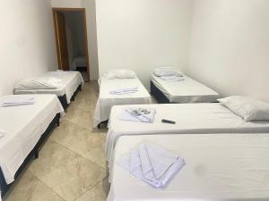Voodi või voodid majutusasutuse Pousada Sagrada Devoção toas