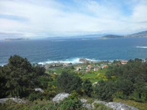 a view of the ocean from a bluff at Hotel Avenida Baiona in Baiona +47 photos