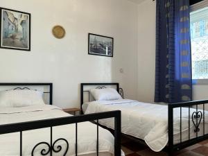 Postel nebo postele na pokoji v ubytování Hotel Al Manar