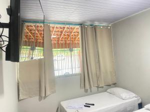 Voodi või voodid majutusasutuse Pousada Sagrada Devoção toas