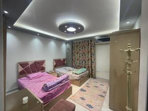 a bedroom with a bed and a couch at Al adl in Cairo