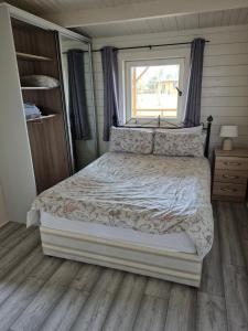 Postel nebo postele na pokoji v ubytování Nellies Cottage B&B
