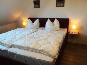 Postel nebo postele na pokoji v ubytování Haus Willi