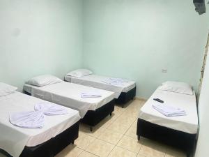 Voodi või voodid majutusasutuse Pousada Sagrada Devoção toas