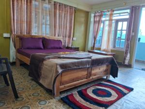 Ένα ή περισσότερα κρεβάτια σε δωμάτιο στο Mahankal Valley Homestay