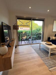 Un televizor și/sau centru de divertisment la Superbe appartement terrasse et parking privé