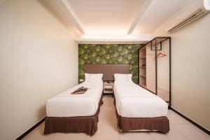 Postel nebo postele na pokoji v ubytování The Mesui Hotel Bukit Bintang + 37 fotografií