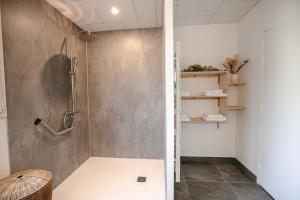 a shower stall in a bathroom with a wall at La Villa de Pen ar Menez terre & mer avec spa in Plouider +31 photos