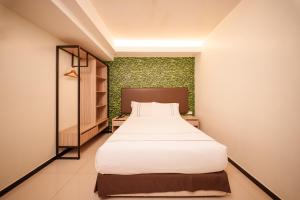 Postel nebo postele na pokoji v ubytování The Mesui Hotel Bukit Bintang
