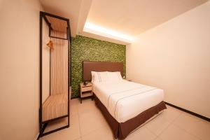 Postel nebo postele na pokoji v ubytování The Mesui Hotel Bukit Bintang