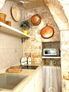 Η κουζίνα ή μικρή κουζίνα στο Dimora Fiore Guest House +7 φωτογραφίες