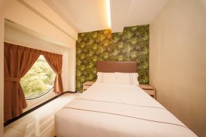 Postel nebo postele na pokoji v ubytování The Mesui Hotel Bukit Bintang
