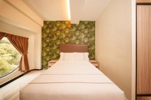 Postel nebo postele na pokoji v ubytování The Mesui Hotel Bukit Bintang