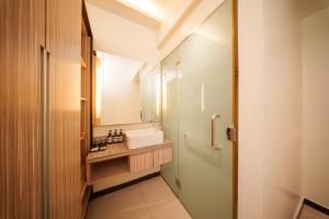 Postel nebo postele na pokoji v ubytování The Mesui Hotel Bukit Bintang