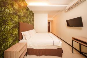 Postel nebo postele na pokoji v ubytování The Mesui Hotel Bukit Bintang