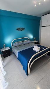 Letto o letti in una camera di STELLA MARINA Apartment