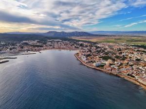 an aerial view of a town next to the water at Rallye Hotel in L'Escala