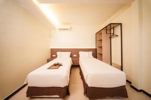 Postel nebo postele na pokoji v ubytování The Mesui Hotel Bukit Bintang