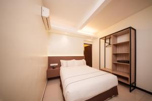 Postel nebo postele na pokoji v ubytování The Mesui Hotel Bukit Bintang