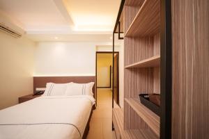 Postel nebo postele na pokoji v ubytování The Mesui Hotel Bukit Bintang