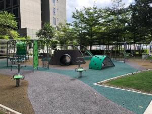 a playground with a slide and a play structure at 3volution Stays in Petaling Jaya