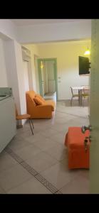 a living room with a couch and a table at La Baia Di Ulisse in Venetico