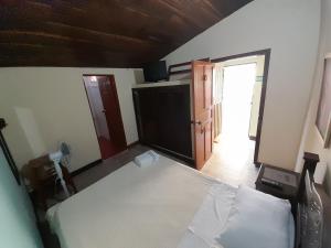 Postel nebo postele na pokoji v ubytování HOSTAL HELICONIAS