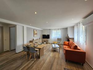 a living room with a couch and a table at Au Farniente in Vallauris
