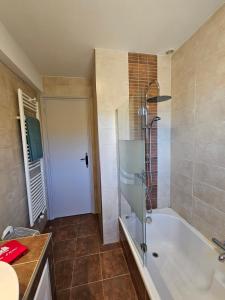 a bathroom with a shower and a bath tub at Au Farniente in Vallauris +12 photos