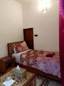 Postel nebo postele na pokoji v ubytování Dar Abdellah