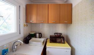 Η κουζίνα ή μικρή κουζίνα στο Anni's Apartments - Full Moon On The Roof +3 φωτογραφίες