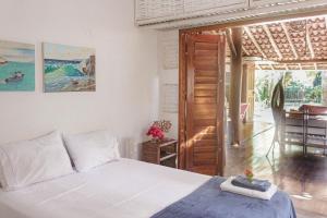Ένα ή περισσότερα κρεβάτια σε δωμάτιο στο Casa da Cacá