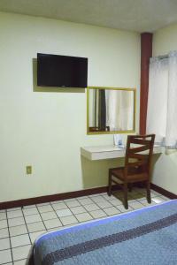 Postel nebo postele na pokoji v ubytování Hotel Topacio