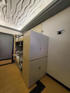 an empty room with a room with a ceiling at Wander Luxe in Tirana