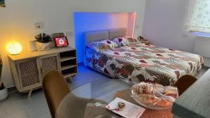 a bedroom with a bed and a table with a glass table at The Dream in Massa Lubrense