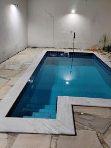 Bazén v ubytování Hospedagem Casa estrada real Paraty nebo v jeho okolí