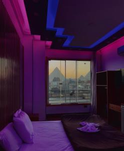Voodi või voodid majutusasutuse Midnight Pyramids View toas