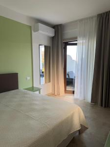 Ένα ή περισσότερα κρεβάτια σε δωμάτιο στο Agriturismo Fraromi