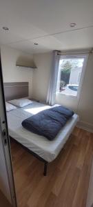 Postel nebo postele na pokoji v ubytování Mobil Home Colorado