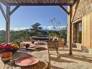 a table with food and fruit on a patio at Villas Inamorata in Lecci