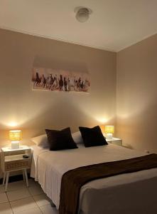 Postel nebo postele na pokoji v ubytování Gaudy's Hotel