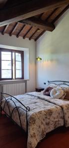Кровать или кровати в номере Buonriposo San Gimignano