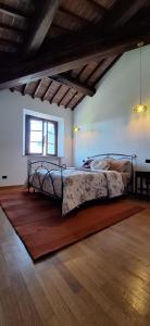 Кровать или кровати в номере Buonriposo San Gimignano